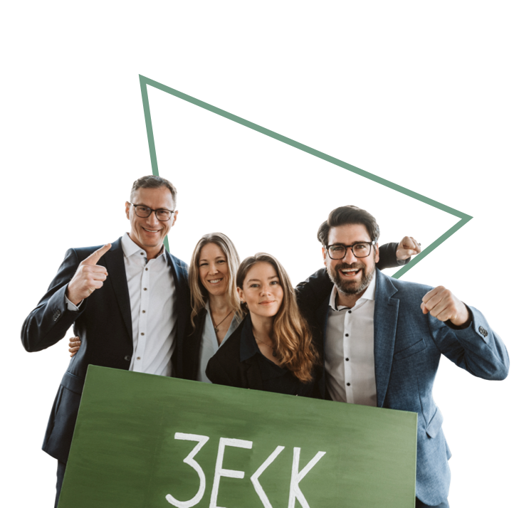 Gurppe an Personen posiert vor einem Schild